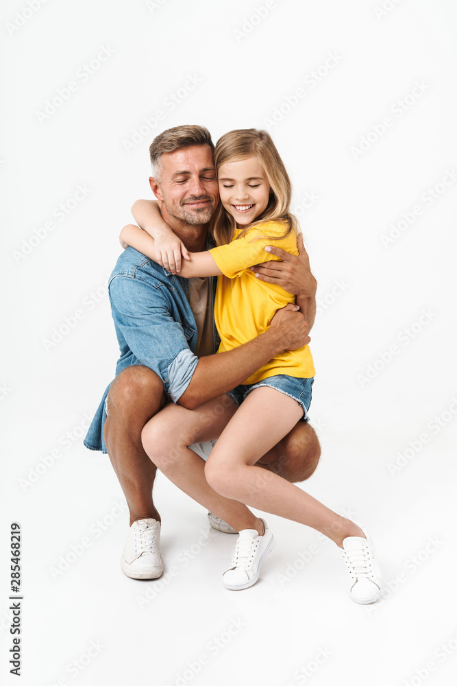Happy father with his little daughter embracing Happy father with his little daughter embracing
