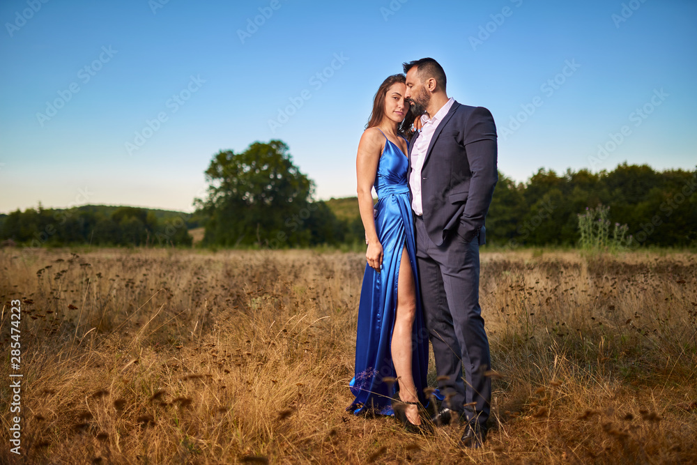 Portrait of a beautiful couple outdoor by the forest
