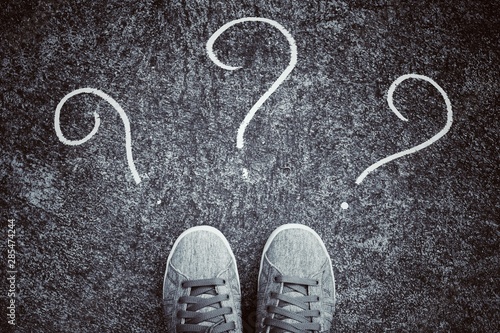 Feet and arrows on road. with question marks. choice concept