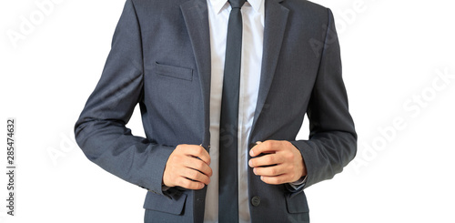 Young businessman in gray suit isolated against white background.