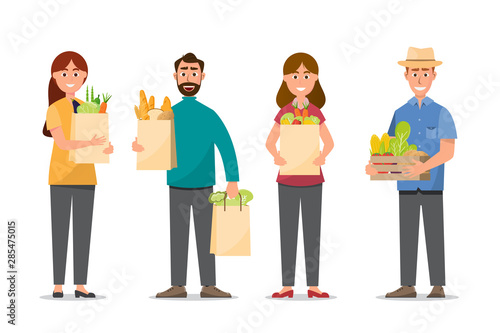 man and woman shopping and holding full bags food