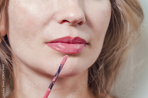 Bold and Seductive: Closeup of Feminine Lips Painted with Ravishing Red Lipstick