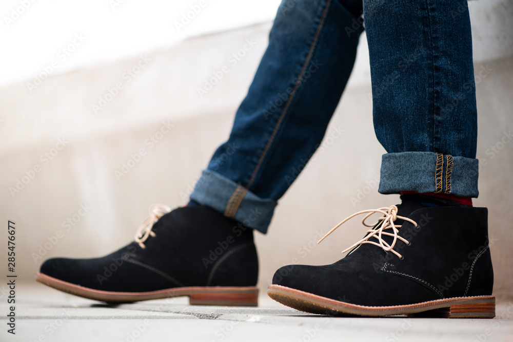 Fashion mens legs in blue jeans and 