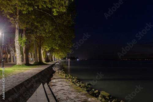 Balaton lakeshore at night in Balatonfoldvar, Hungary.