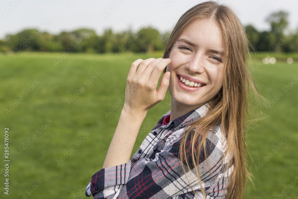 Front view beautiful girl smiling outside Front view beautiful girl smiling outside