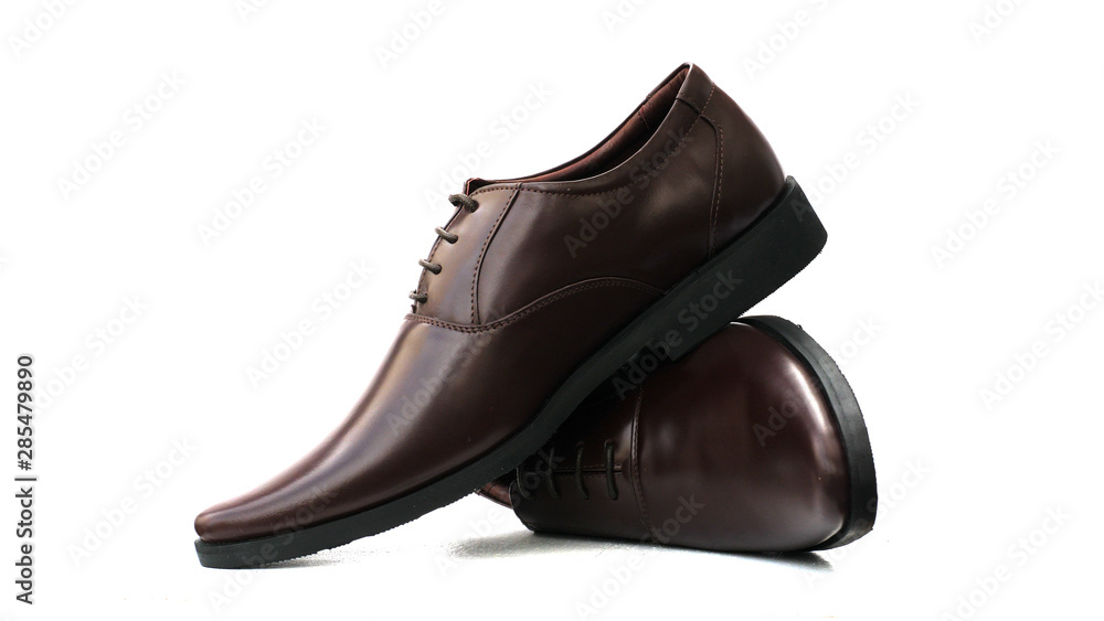 Mens brown shoes isolated on a white background.