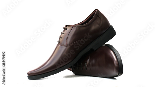 Mens brown shoes isolated on a white background.