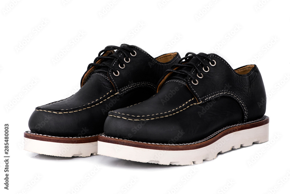 Man fashion close-up a pair of black shoe isolated on a white background. Man fashion close-up a pair of black shoe isolated on a white background.