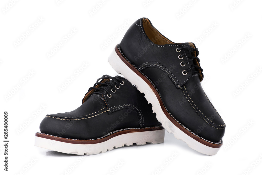 Man fashion close-up a pair of black shoe isolated on a white background. Man fashion close-up a pair of black shoe isolated on a white background.