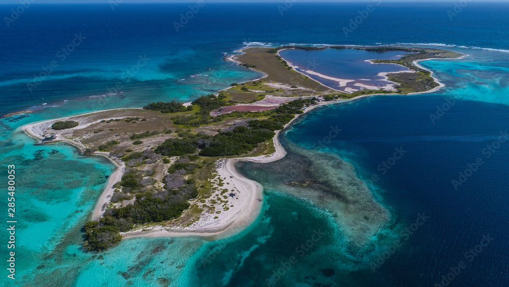 Caribbean: Vacation in the blue sea and deserted islands. Aerial view of a blue sea with crystal water. Great landscape. Beach scene. Aerial View Island Landscape Los Roques