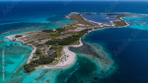 Fototapeta Naklejka Na Ścianę i Meble -  Caribbean: Vacation in the blue sea and deserted islands. Aerial view of a blue sea with crystal water. Great landscape. Beach scene. Aerial View Island Landscape Los Roques