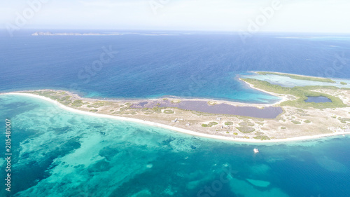 Caribbean: Vacation in the blue sea and deserted islands. Aerial view of a blue sea with crystal water. Great landscape. Beach scene. Aerial View Island Landscape Los Roques