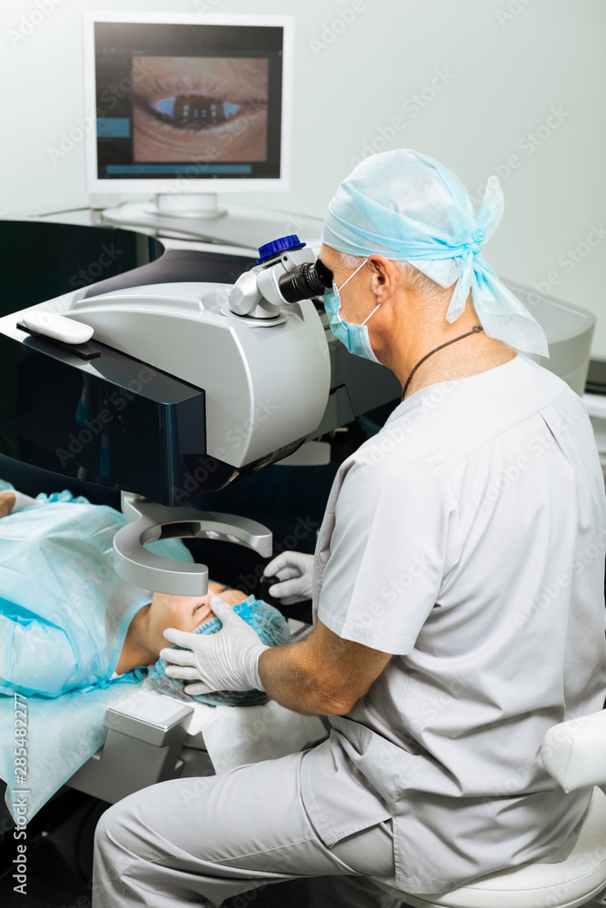 Nice professional doctor doing the medical operation Nice professional doctor doing the medical operation