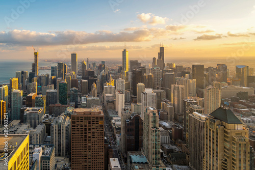 Beautiful scenic view of business district of Chicago loop with skyline in evening sunlight. Panoramic view aerial top view or drone architecture view of city. Famous attraction in Chicago, USA. photo