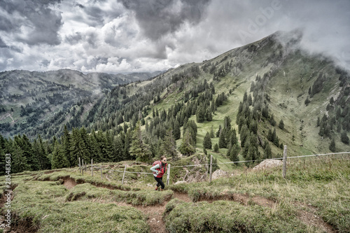 senior woman hiking in autu...