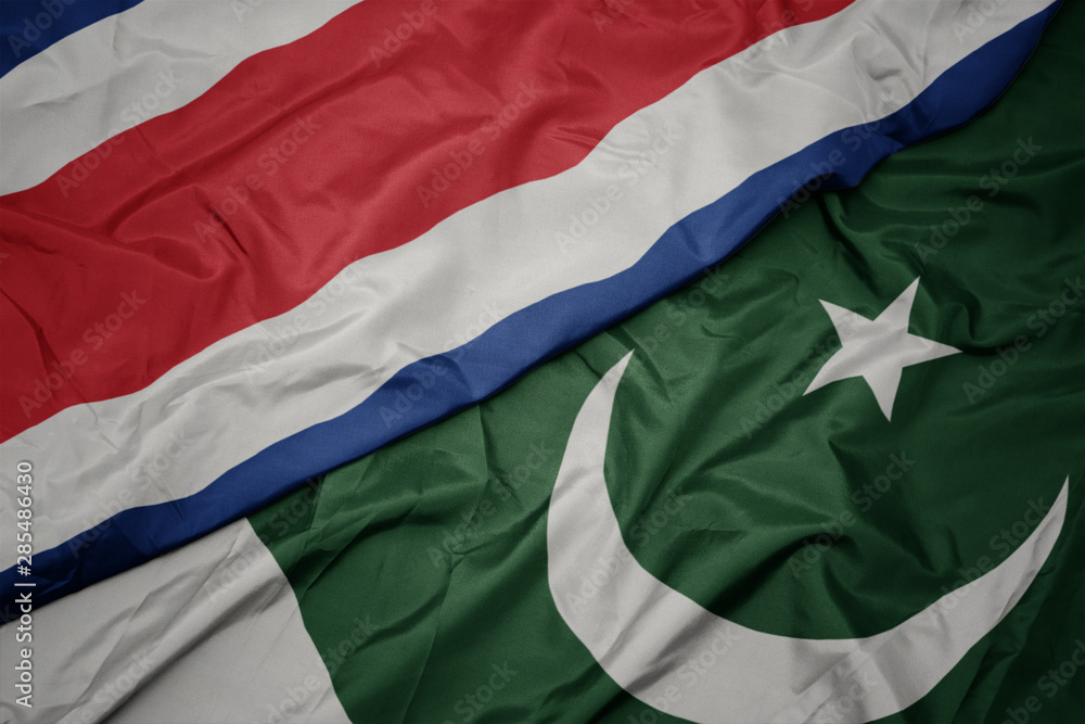 waving colorful flag of pakistan and national flag of costa rica.