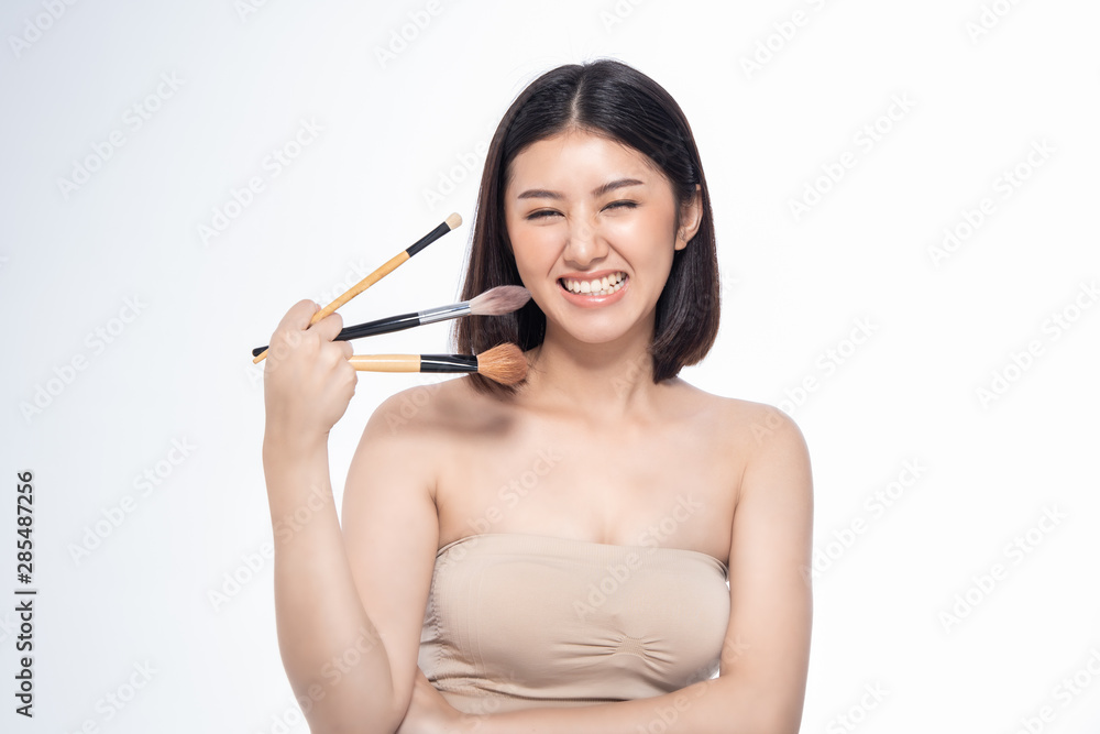 Beautiful Young Asian Woman short hair with Clean Fresh Skin. Face care, Facial treatment, Cosmetology, beauty and healthy skin and cosmetic ideas concept. Beautiful Young Asian Woman short hair with Clean Fresh Skin. Face care, Facial treatment, Cosmetology, beauty and healthy skin and cosmetic ideas concept.