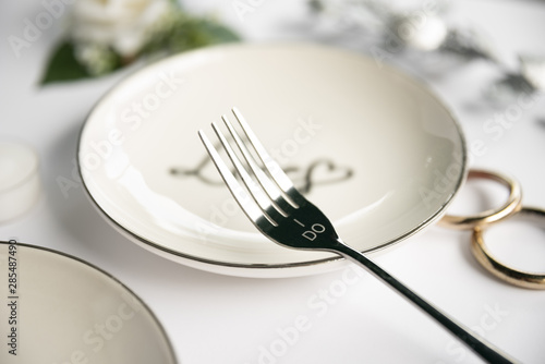 Close-up fork with wedding rings
