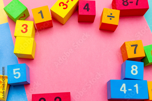 child kid colorful education toys cubes with numbers math pattern background on the bright background. Flat lay. Childhood infancy children babies concept.