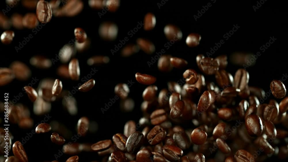 Super slow motion of flying coffee beans. Filmed on high speed cinema camera, 1000 fps. Super slow motion of flying coffee beans. Filmed on high speed cinema camera, 1000 fps.