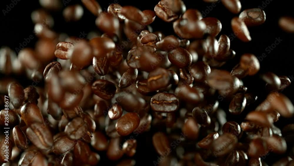 Super slow motion of flying coffee beans. Filmed on high speed cinema camera, 1000 fps. Super slow motion of flying coffee beans. Filmed on high speed cinema camera, 1000 fps.