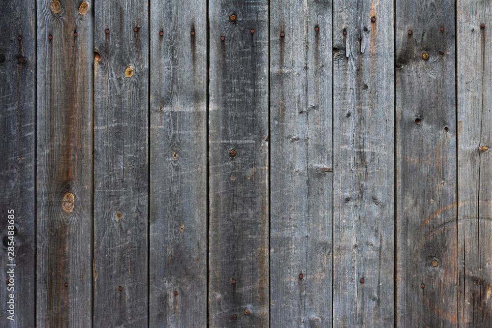 Wood background. Old gray wooden fence with nails. Vintage style. Wood background. Old gray wooden fence with nails. Vintage style.