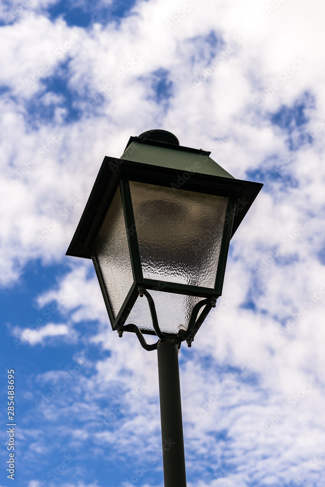 Portugeese latern wih cloudy backdrop Portugeese latern wih cloudy backdrop