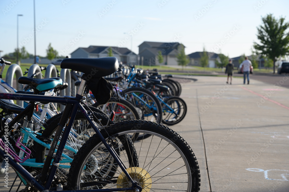 row of children bikes outside school