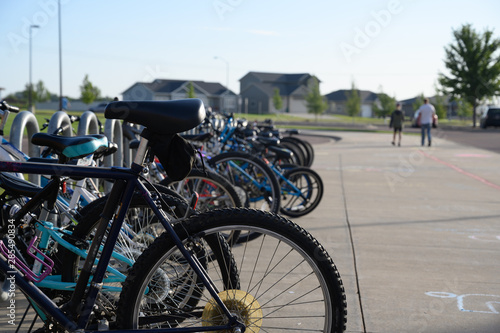 row of children bikes outside school