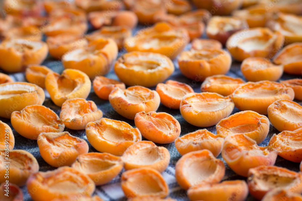 Fresh summer harvest of sun-dried mellow apricots preparing
