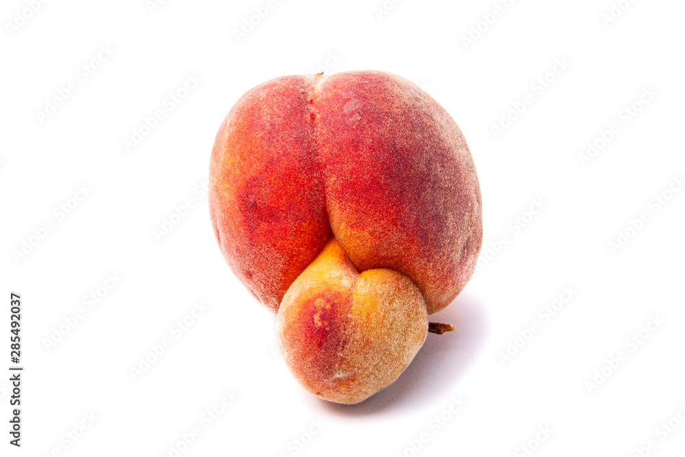 Trendy ugly food. Peach fruit isolated on white background. Misshapen produce, food waste problem concept. Trendy ugly food. Peach fruit isolated on white background. Misshapen produce, food waste problem concept.