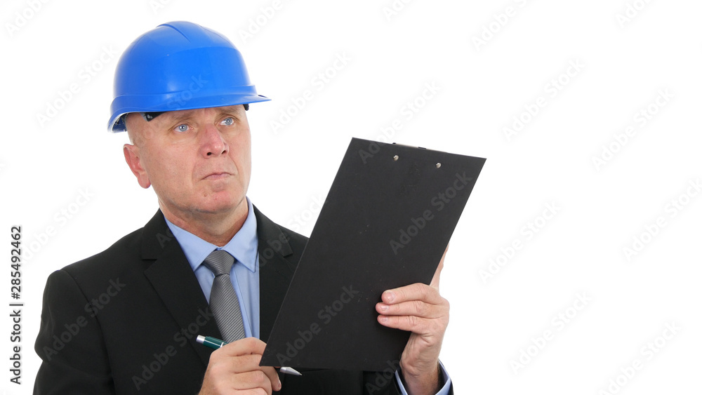 Image with Engineer Reading and Writing in Agenda Technical Notes Image with Engineer Reading and Writing in Agenda Technical Notes