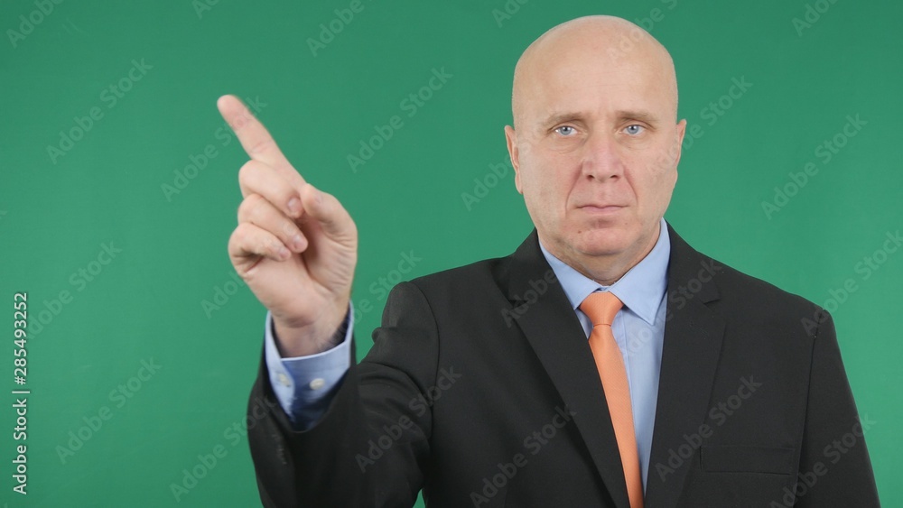 Businessman with Green Background Indicate a Direction with Finger Sign Businessman with Green Background Indicate a Direction with Finger Sign