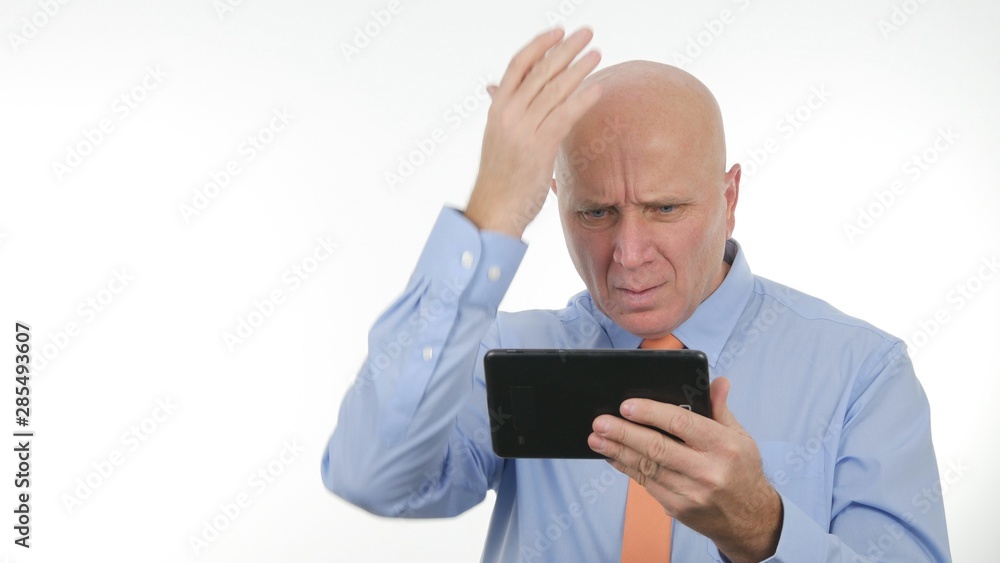 Businessman Gesturing Nervous and Unhappy After Reading Bad Message on Table Businessman Gesturing Nervous and Unhappy After Reading Bad Message on Table