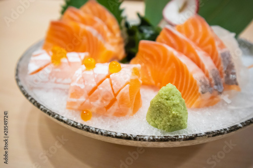 Wasabi with Fresh salmon slice sashimi serve on ice Japanese style