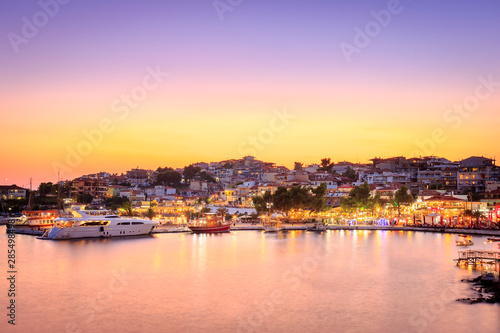 Amazing Neos Marmaras cityscape and harbor sunset with reflective, silky, sea water