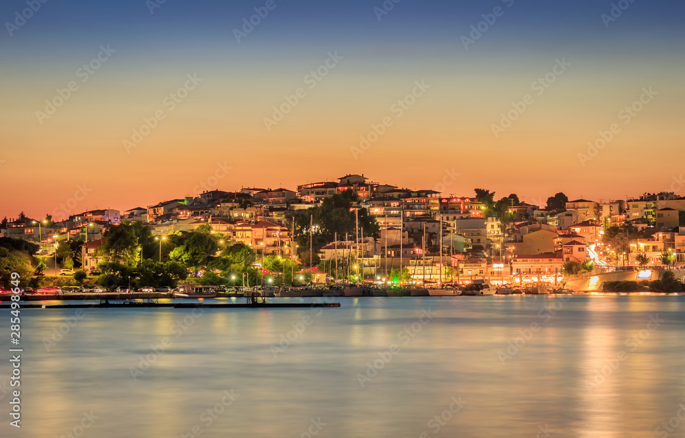 Amazing Neos Marmaras cityscape and harbor sunset with reflective, silky, sea water