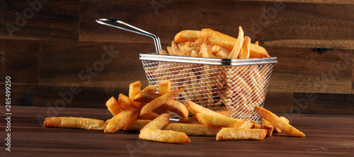Photos Tasty french fries potato on wooden table background