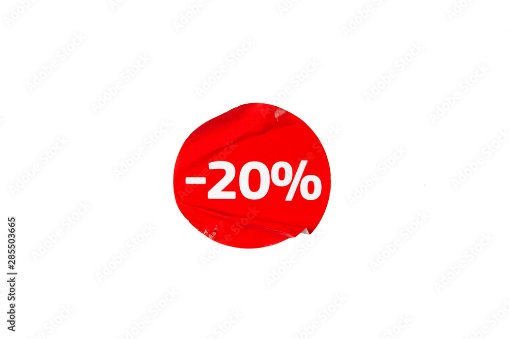 Round crumpled red sticker discount on a white background is isolated. Round crumpled red sticker discount on a white background is isolated.