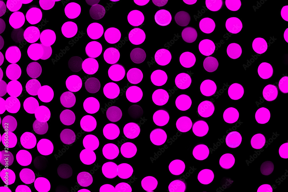 Unfocused abstract pink bokeh on black background. defocused and blurred many round light Unfocused abstract pink bokeh on black background. defocused and blurred many round light