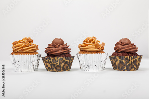 Four Chocolate and Caramel Cup Cakes photo