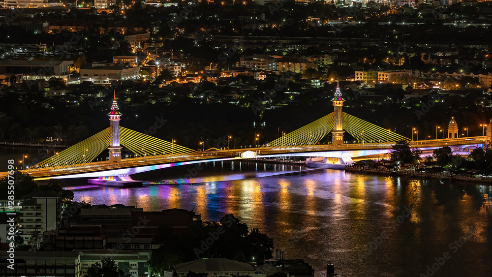 Maha Chesadabodindranusorn Bridge at night with beautiful color full light , Bangkok Thailand