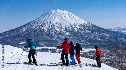 Group Ski Activity at Niseko winter Yotei mountain background photo