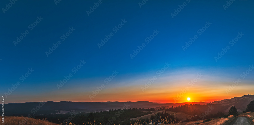 Panoramic Sunrise over Mountains and Hills