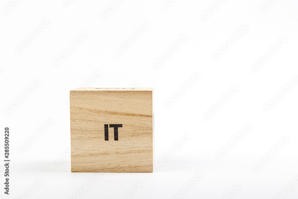 Wooden cubes with the inscription it on a white background Wooden cubes with the inscription it on a white background