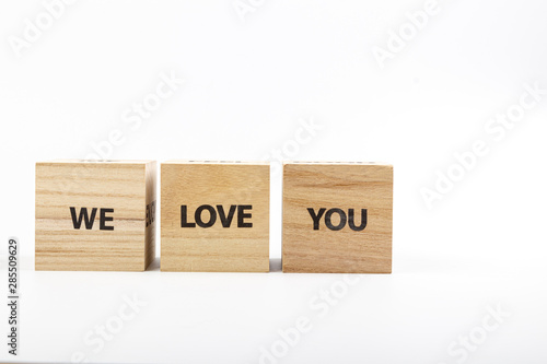 Wallpaper Mural Wooden cubes with the inscriptionWe Love You on a white background Torontodigital.ca