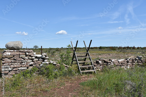 Wooden stile by an old dry stone wall