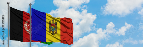 Afghanistan and Moldova flag waving in the wind against white cloudy blue sky together. Diplomacy concept, international relations.