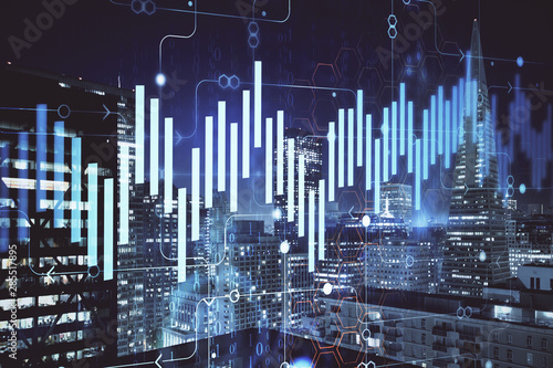 Financial graph on night city scape with tall buildings background multi exposure. Analysis concept.