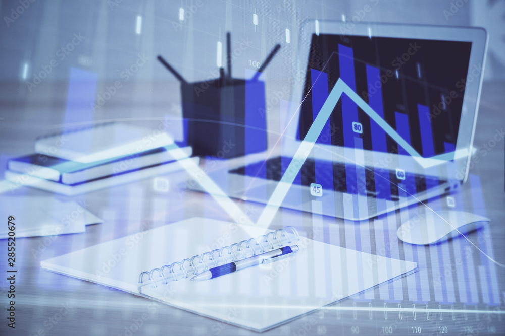 Stock market graph on background with desk and personal computer. Double exposure. Concept of financial analysis. Stock market graph on background with desk and personal computer. Double exposure. Concept of financial analysis.